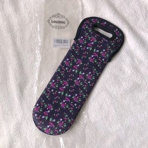 New in package, wine bottle tote. Navy blue and floral insulated wine cozy tote.